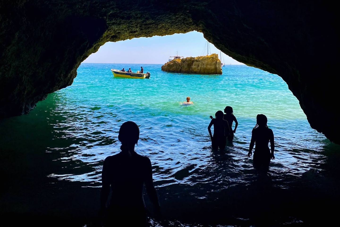 Photo of people in a cave off the coast