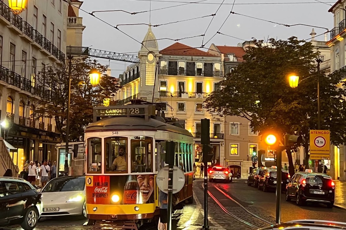 Photo of a streetscape featuring a cable car