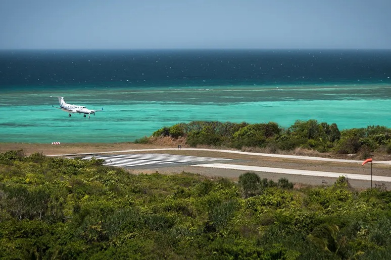 Amanpulo-Gallery-18 Photo of a private jet coming in for a landing on a coastline airstrip