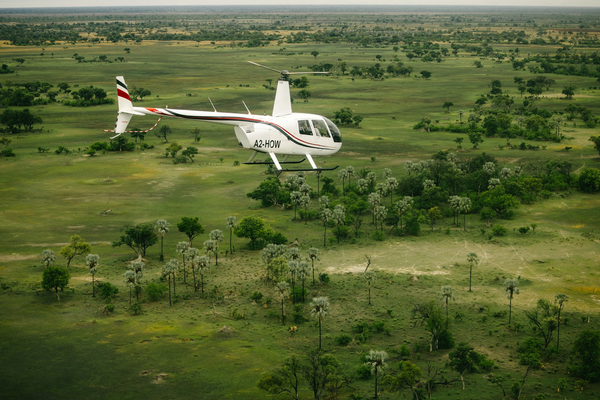 EIL-LEIS-250724-15 Photo of a helicopter flying over a remote plain.