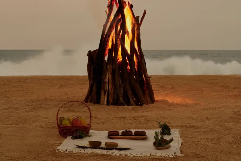 candm-Culture-and-Heritage photo of a beach bon fire and a picnic dinner.