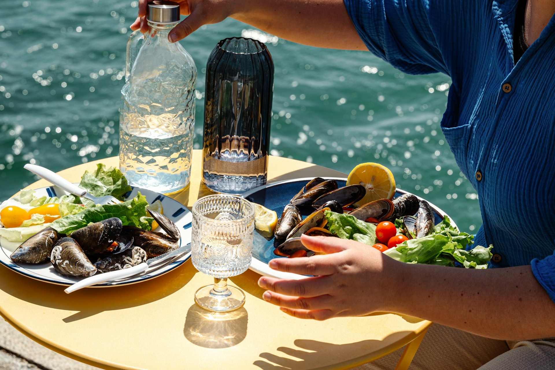 a-c-a9IpO0hKgVE-unsplash Photo of a seafood meal on the deck of a yacht
