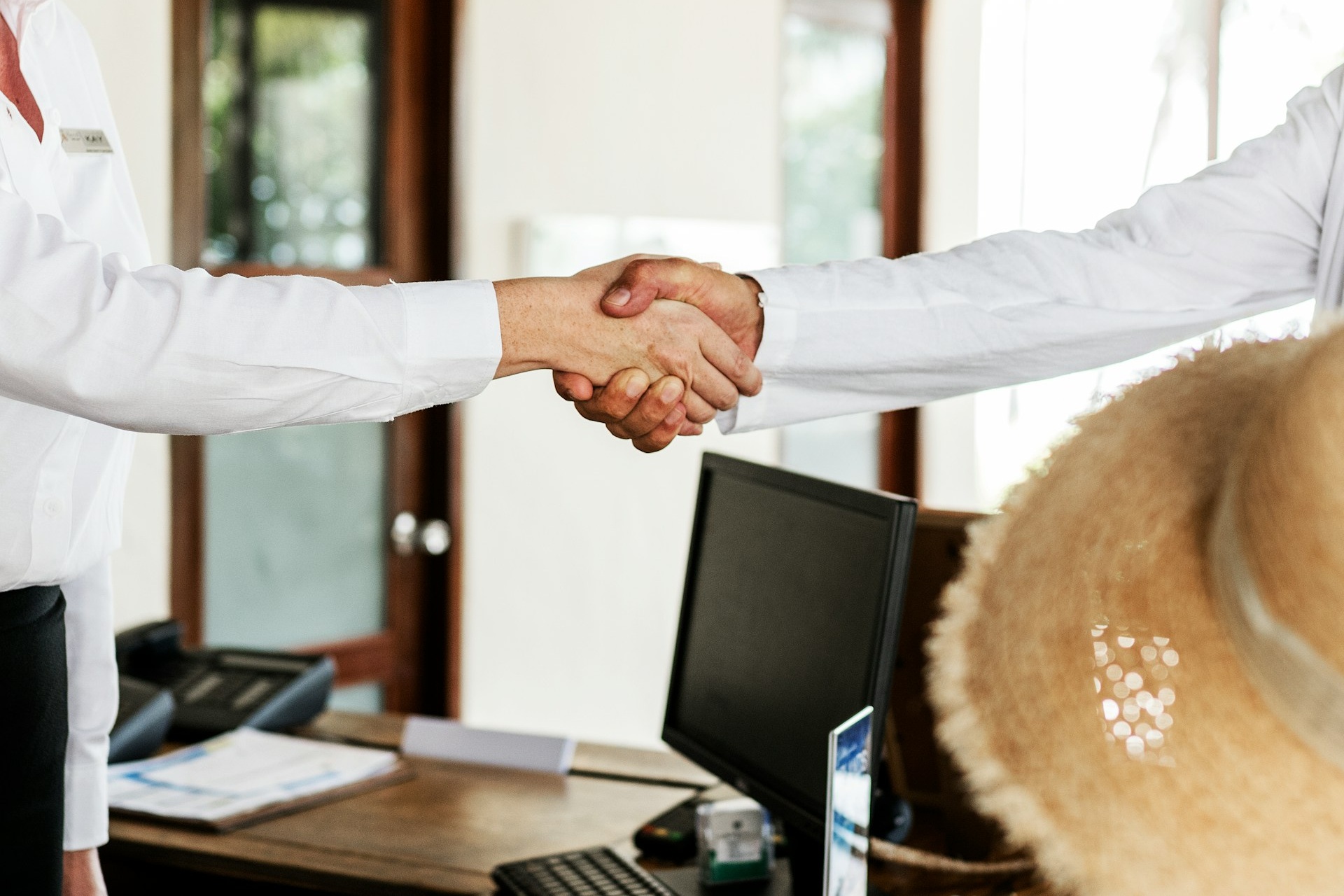 Photo of two people shaking hands