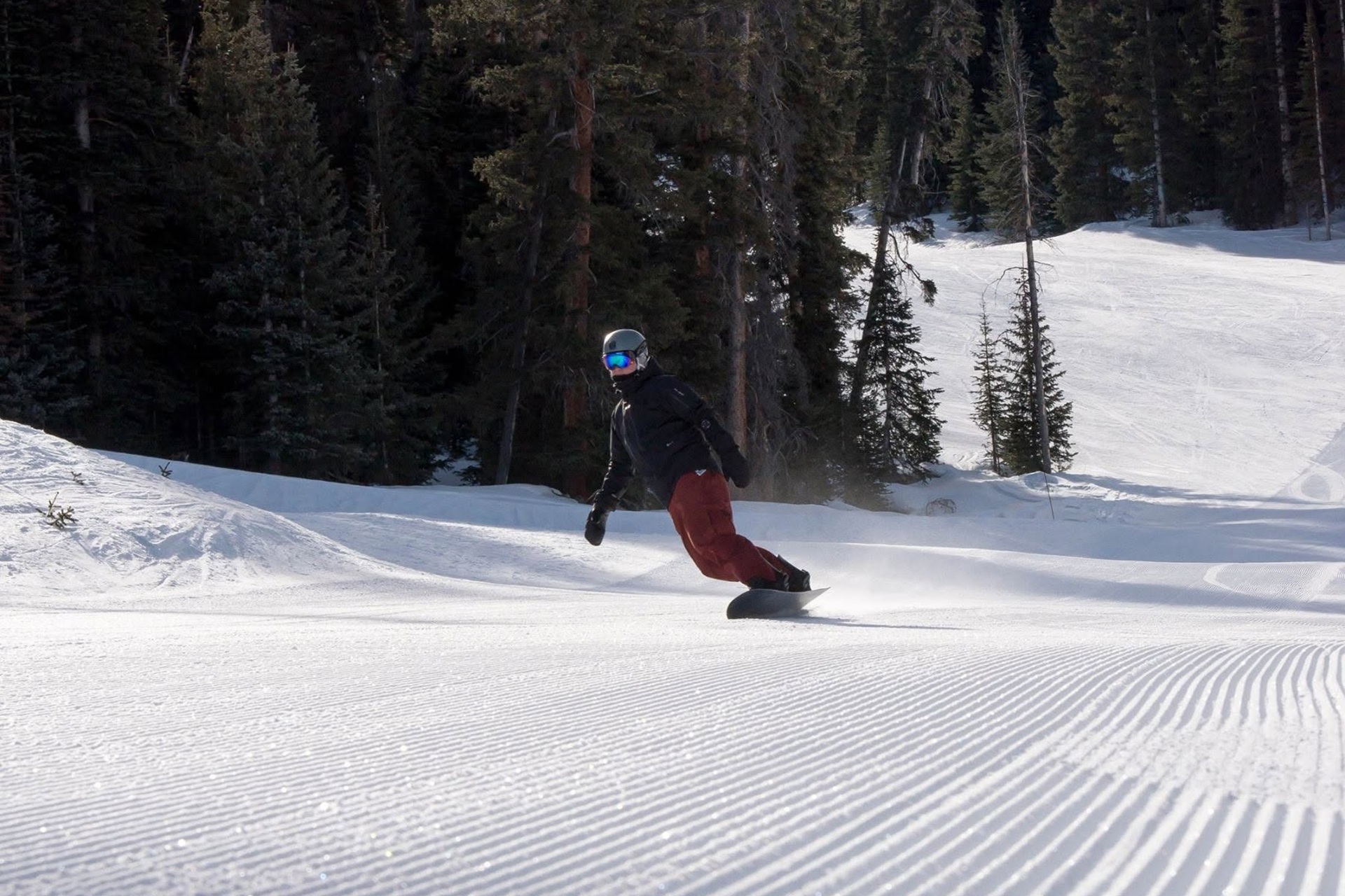 farver-rezza-ski-1920 Snow boarder shredding down a a newly raked hill