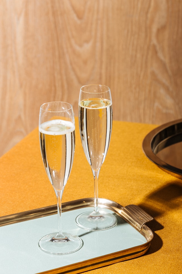 Photo of two newly poured champagne flutes